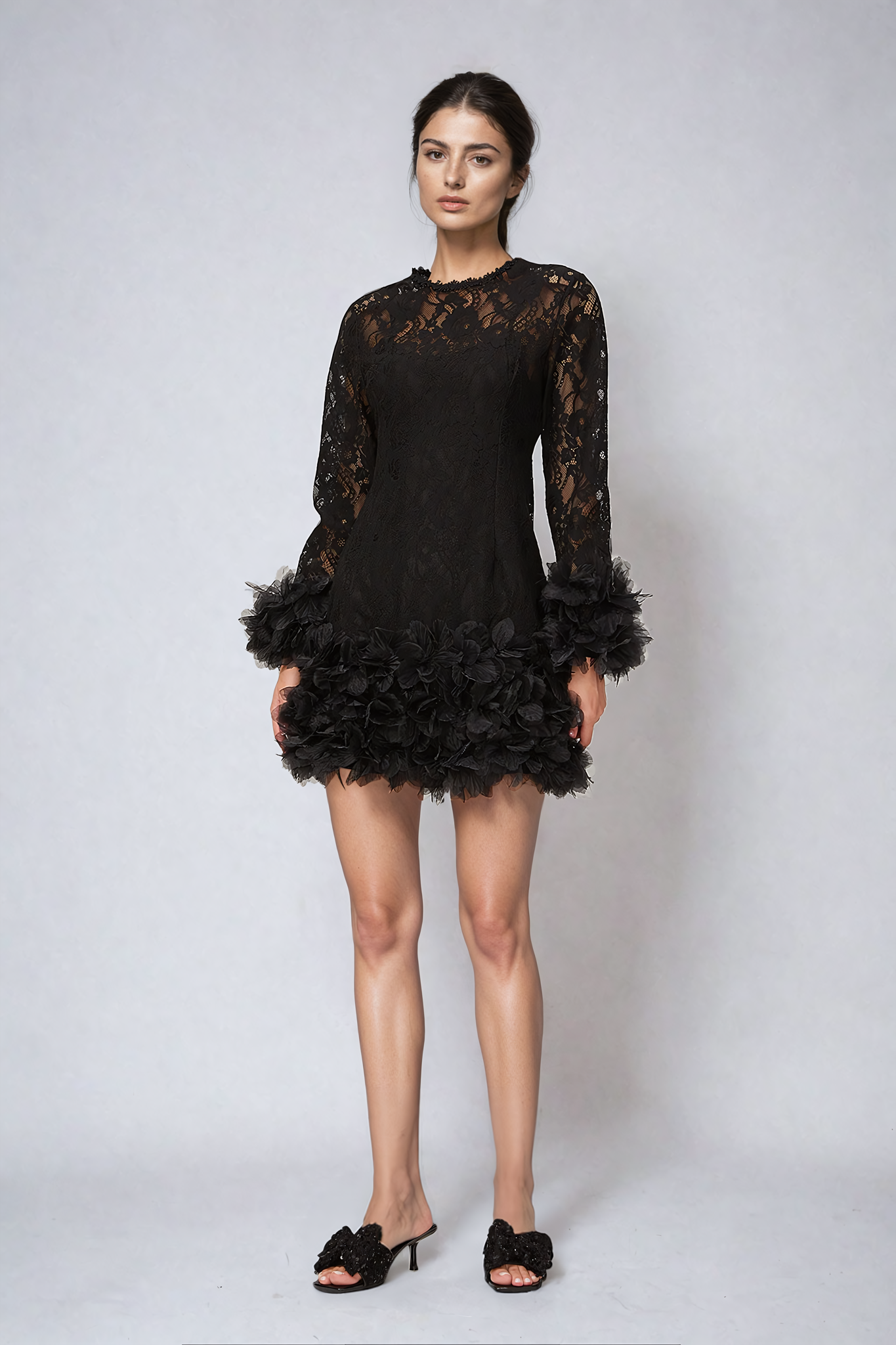 Black mini dress with lace layering and feather trim