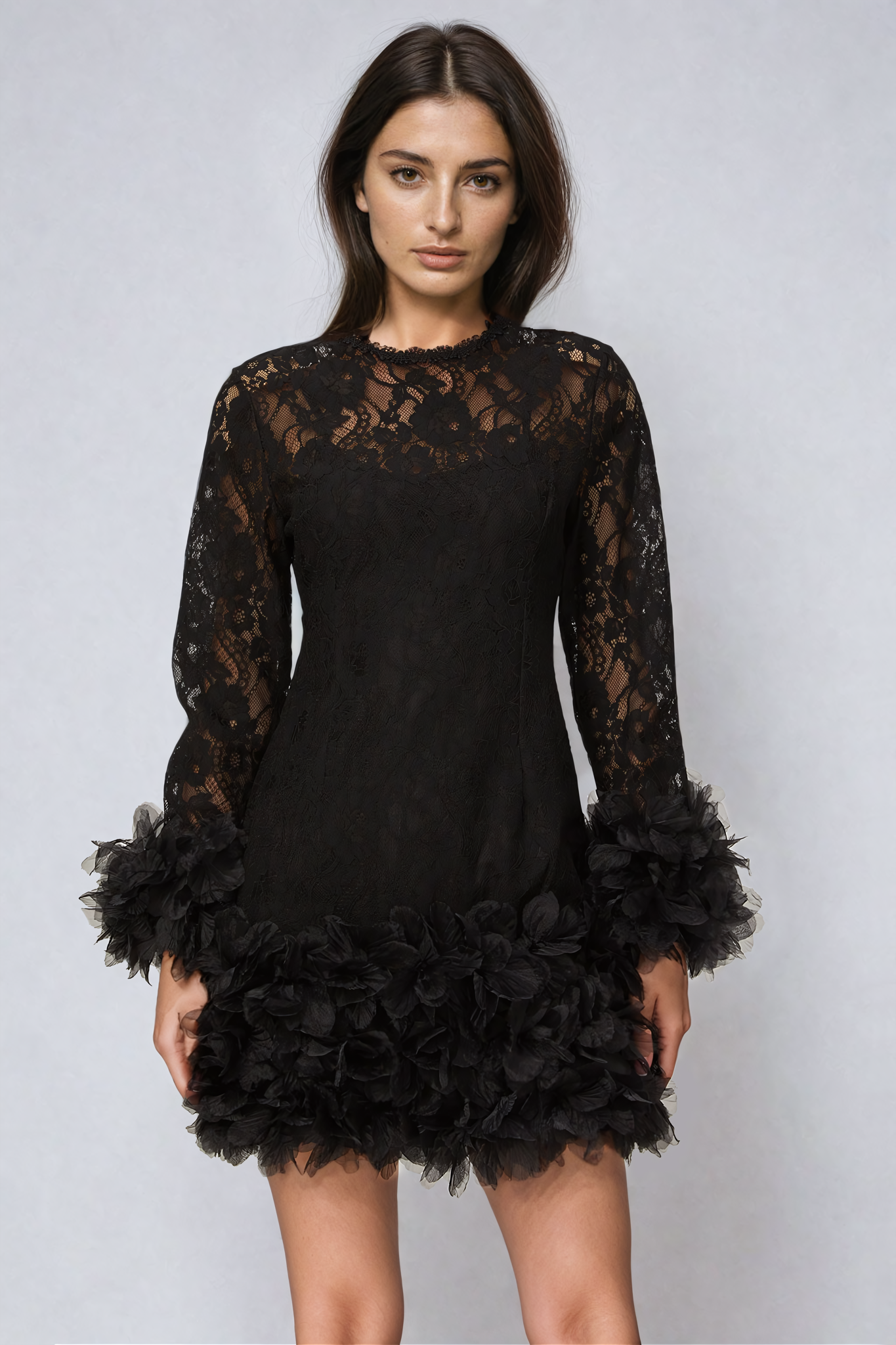 Black mini dress with lace layering and feather trim