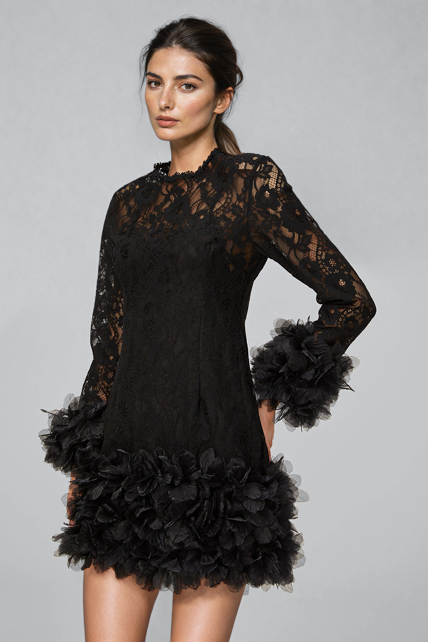 Black mini dress with lace layering and feather trim