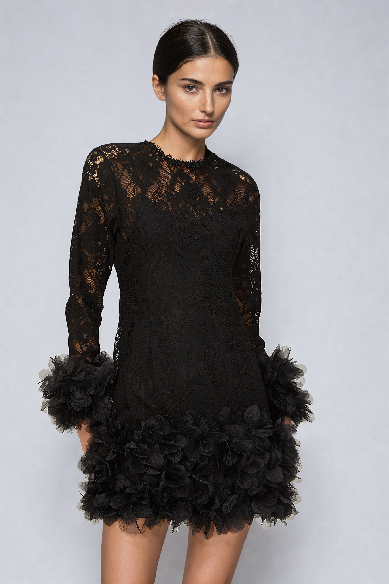 Black mini dress with lace layering and feather trim